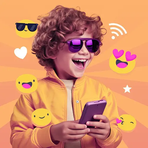 A happy boy is wearing sunglasses and holding a mobile phone
